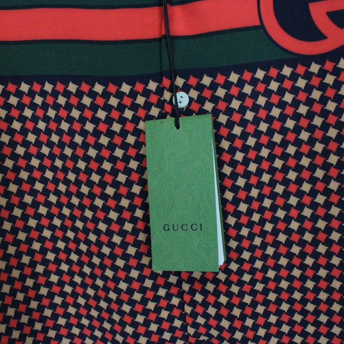 Gucci silk short sleeve bowling shirt in red and navy blue houndstooth pattern.