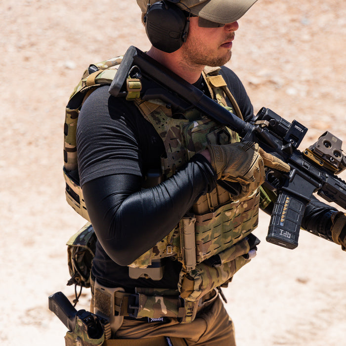 Side view of ICESLEEVES on an athlete demonstrating range of motion, slim fit, and compatibility with uniforms or outer layers.