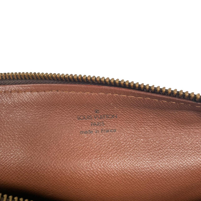 Louis Vuitton duffel bag brown and tan monogram canvas with logo pattern and wear.
