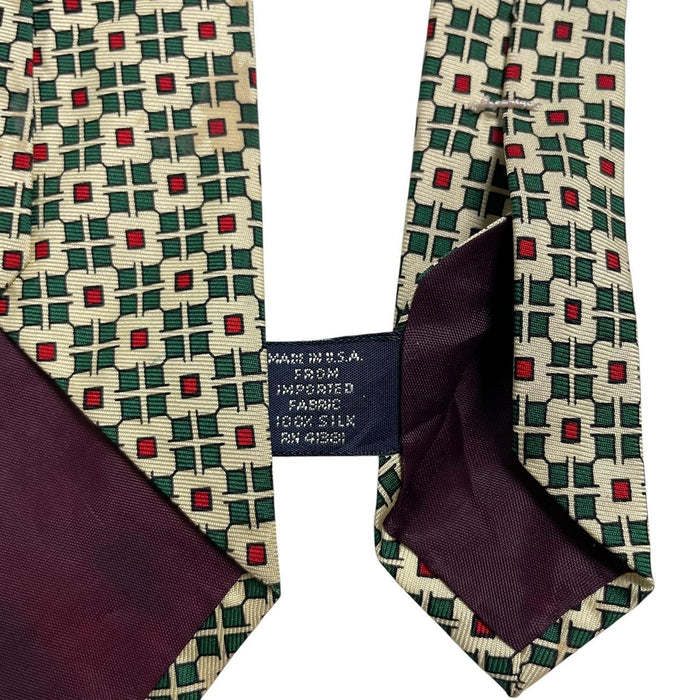 Polo Ralph Lauren yellow silk tie with geometric print design and logo detail.