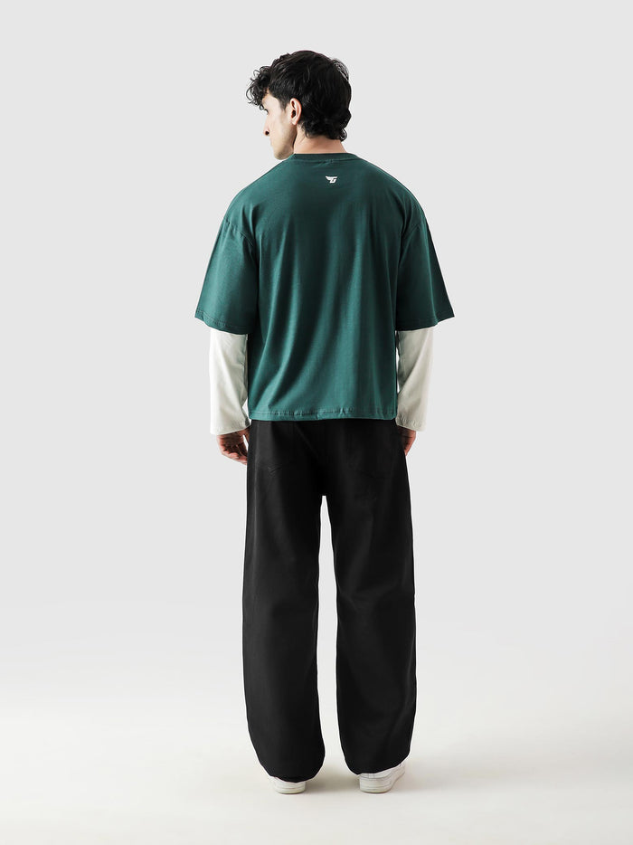 96 Double Layer Jersey racing green male model seated lifestyle Pakistan – GROOVY