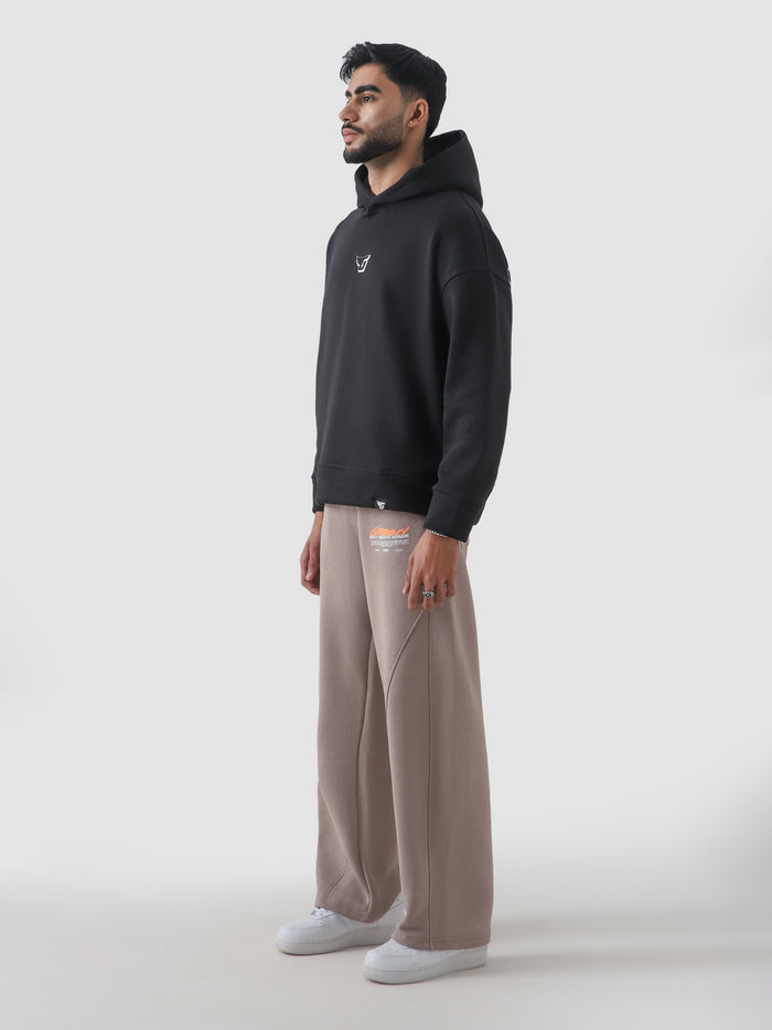 All Hustle No Luck hoodie male model seated half body lifestyle Pakistan – GROOVY