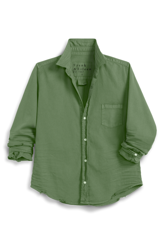 Green shirt with rolled-up sleeves on a white background
