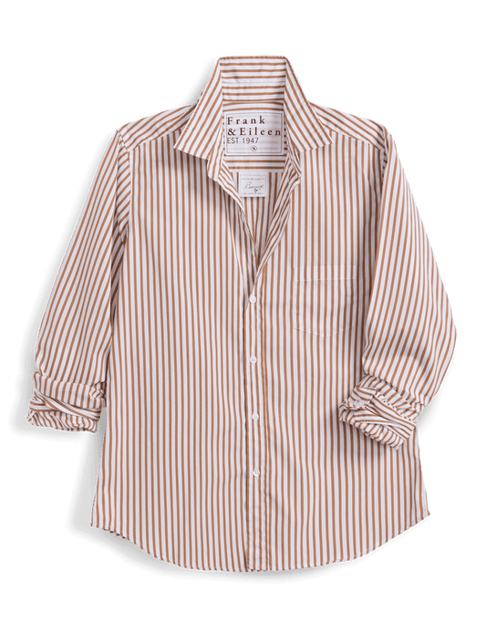 A long-sleeve button-up shirt by Frank & Eileen, featuring vertical stripes in a warm rust-orange and cream colorway. The shirt has a pointed collar, a chest pocket, and rolled-up sleeves, presented on a clean white background.