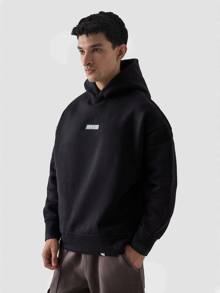 Black oversized hoodie detail closeup front print streetwear – GROOVY Pakistan
