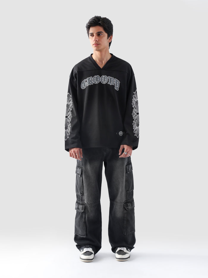 Front view of GROOVY's Chrome Hearts-inspired full sleeves jersey in gothic black with bold arm prints.