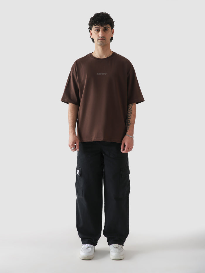 Mocha brown oversized t-shirt male model full body front view Pakistan – GROOVY CORE Tees