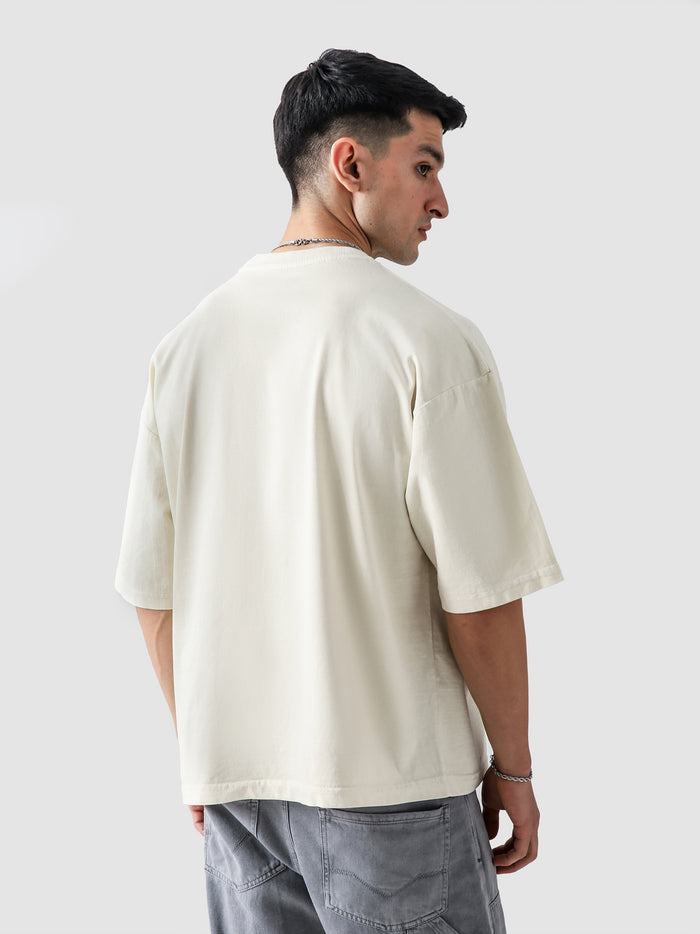 Cream Washed Blank Tee Male Model Side View – GROOVY Pakistan