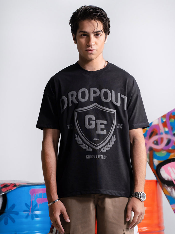 Black Dropout graphic tee male model full body front view oversized – GROOVY Pakistan