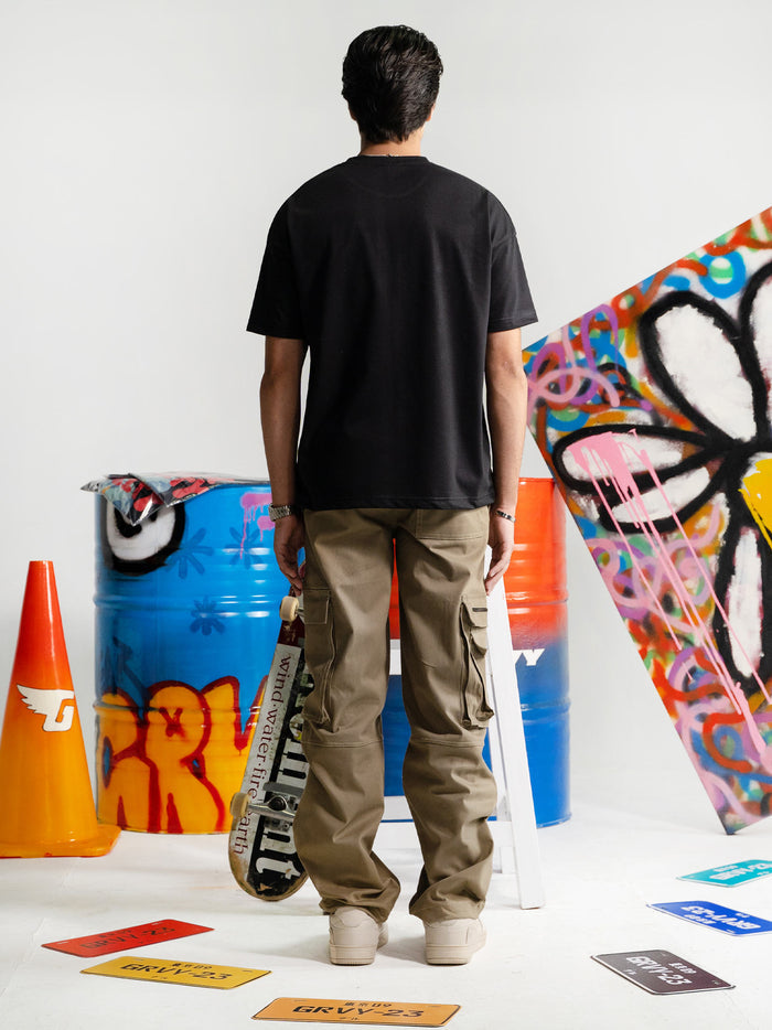 Black Oversized Tee Male Model Back View – Dropout – GROOVY Pakistan