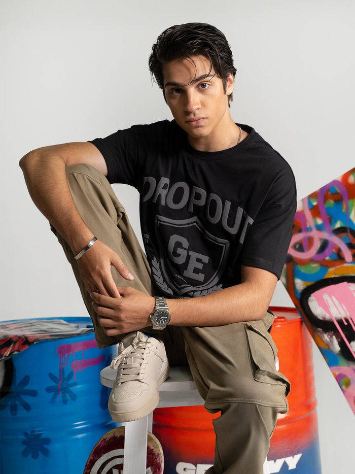 Black Graphic Tee Male Model Side Angle – Dropout – GROOVY Pakistan