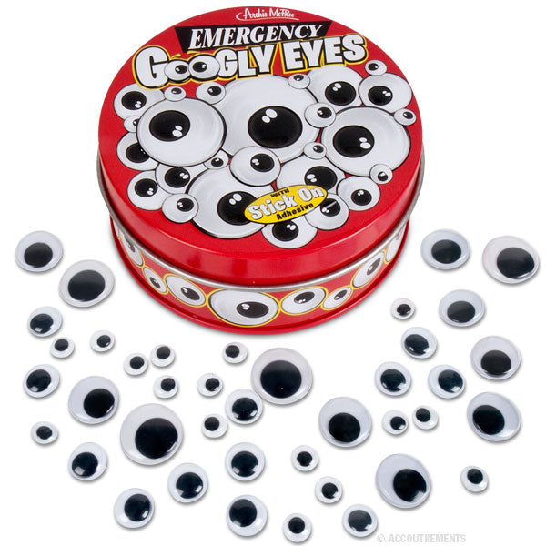 The Emergency Googly Eyes tin in red is encircled by an assortment of sticky-backed plastic eyes in different sizes for convenient use.