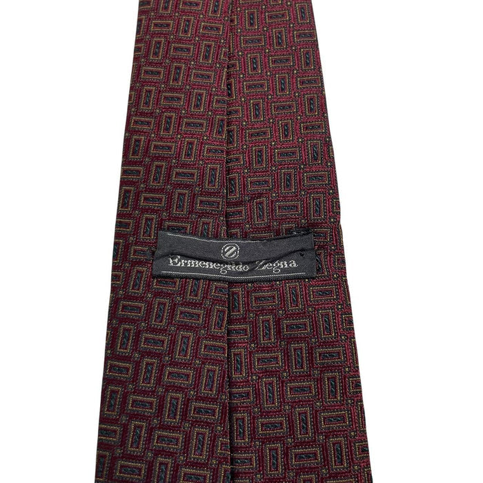 Ermenegildo Zegna burgundy silk tie with geometric print design and logo detail.