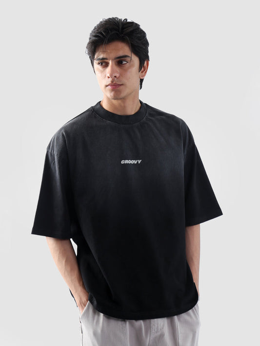 Fade washed oversized tee male model half body lifestyle streetwear Pakistan – GROOVY