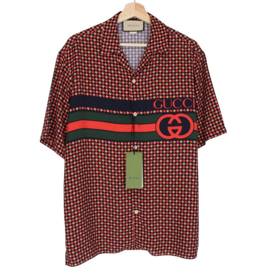 Gucci silk short sleeve bowling shirt in red and navy blue houndstooth pattern.