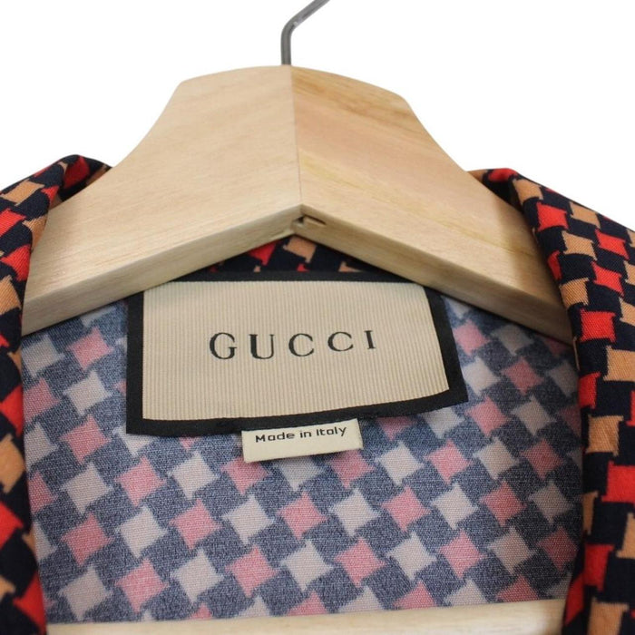 Gucci silk short sleeve bowling shirt in red and navy blue houndstooth pattern.