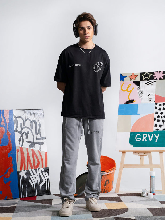 Initial Assembly black graphic tee male model full body front view Pakistan – GROOVY