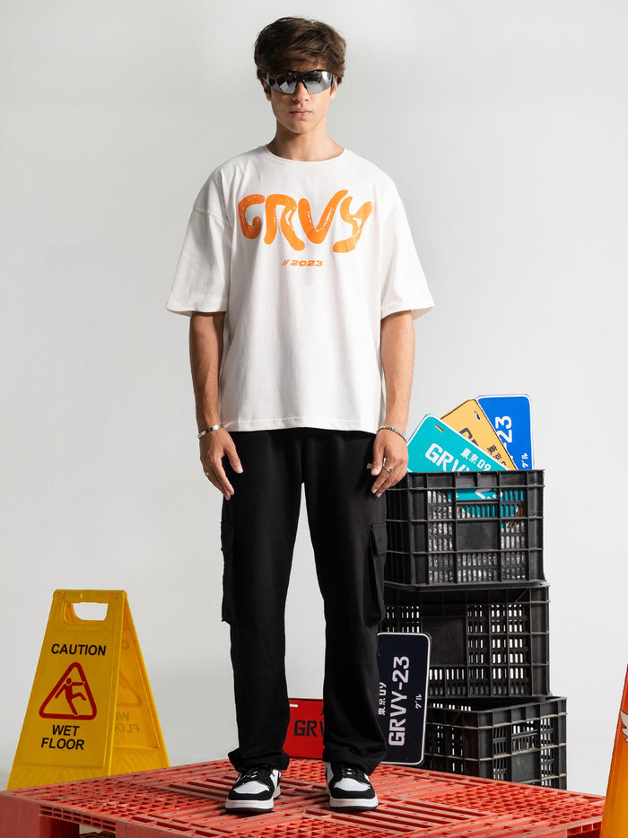 Pearl White Tee Male Model Front View – Legacy Is The Vision – GROOVY Pakistan