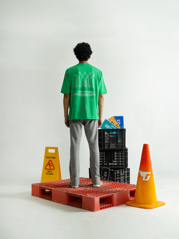 Emerald Green Tee Male Model Side View – Never Give Up – GROOVY Pakistan