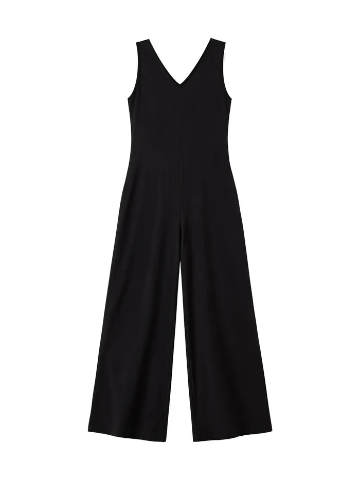 Elegant black jersey jumpsuit with V neckline and loose wide leg trousers