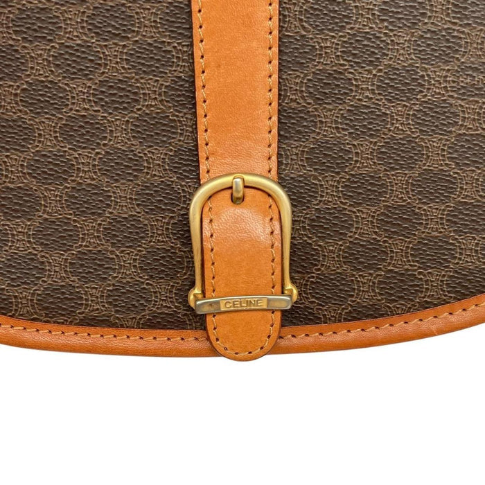 CELINE brown and tan duffel bag with Macadam pattern and leather/canvas material.