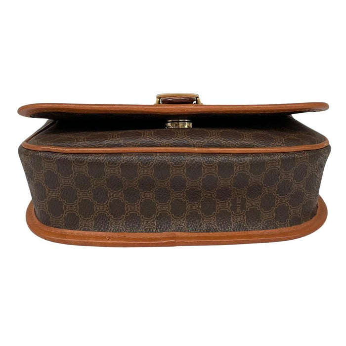 CELINE brown and tan duffel bag with Macadam pattern and leather/canvas material.