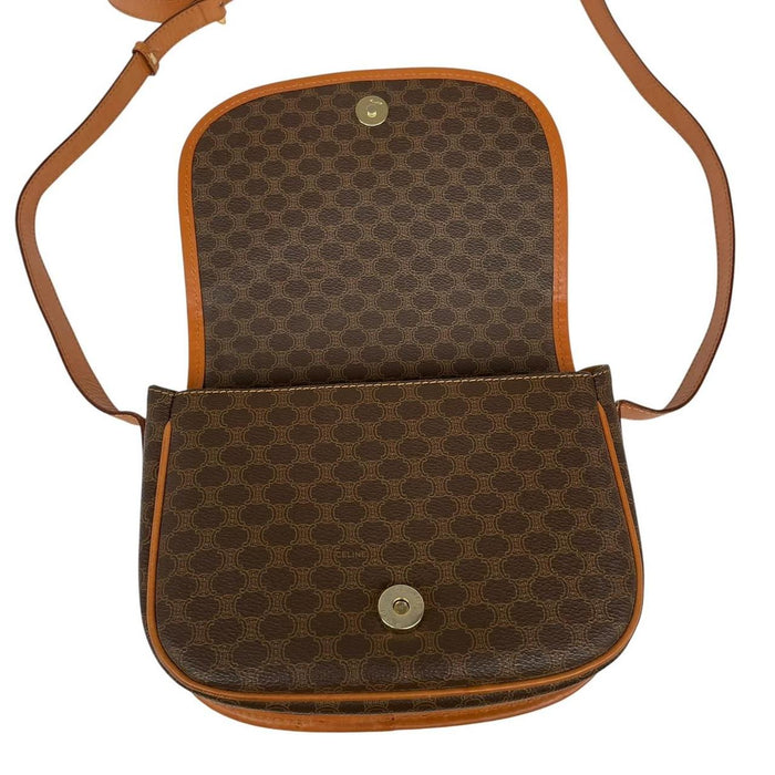 CELINE brown and tan duffel bag with Macadam pattern and leather/canvas material.