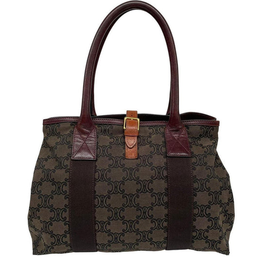 CELINE brown duffel bag with Macadam Triomphe pattern and canvas material.
