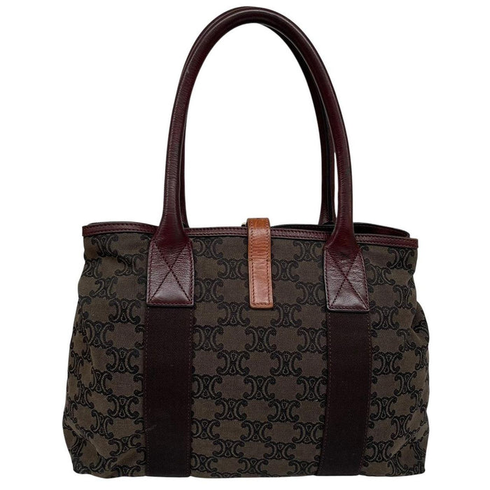 CELINE brown duffel bag with Macadam Triomphe pattern and canvas material.