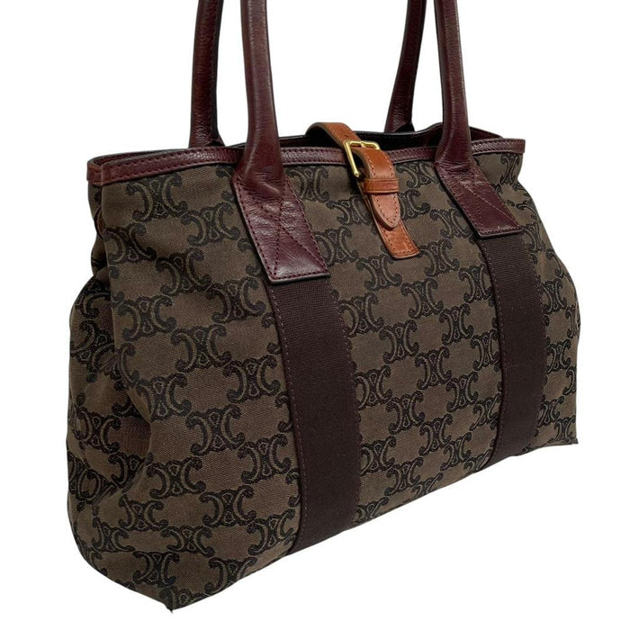 CELINE brown duffel bag with Macadam Triomphe pattern and canvas material.