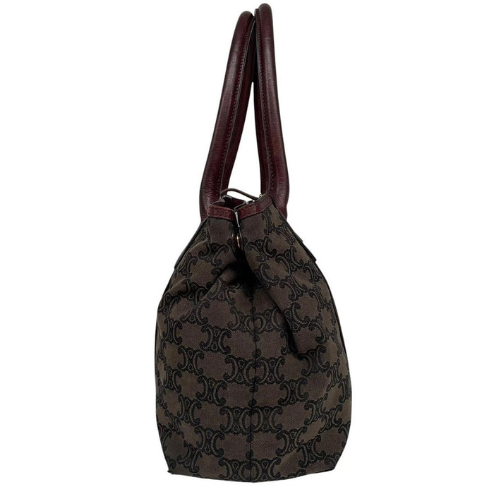 CELINE brown duffel bag with Macadam Triomphe pattern and canvas material.