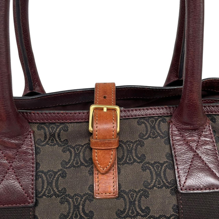 CELINE brown duffel bag with Macadam Triomphe pattern and canvas material.