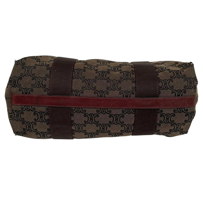 CELINE brown duffel bag with Macadam Triomphe pattern and canvas material.