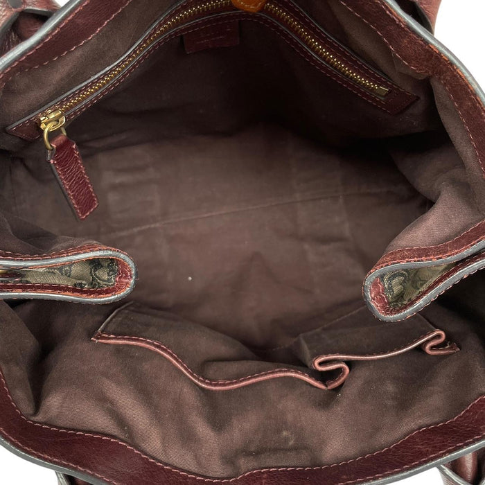 CELINE brown duffel bag with Macadam Triomphe pattern and canvas material.