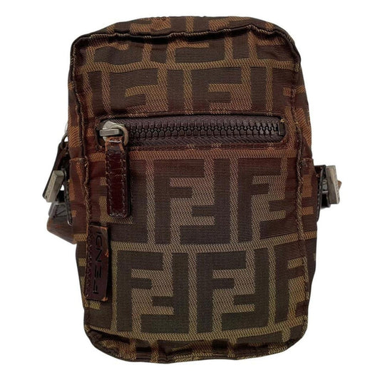 Fendi brown duffel bag with monogram canvas, visible wear and cracking on strap.