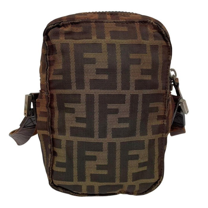 Fendi brown duffel bag with monogram canvas, visible wear and cracking on strap.
