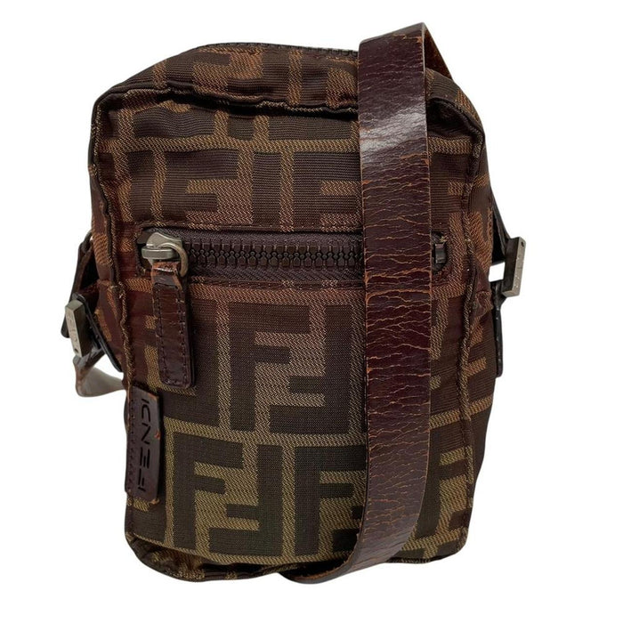 Fendi brown duffel bag with monogram canvas, visible wear and cracking on strap.