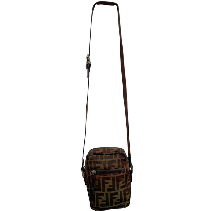 Fendi brown duffel bag with monogram canvas, visible wear and cracking on strap.