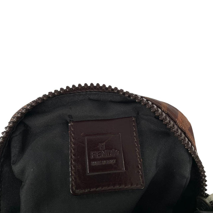 Fendi brown duffel bag with monogram canvas, visible wear and cracking on strap.