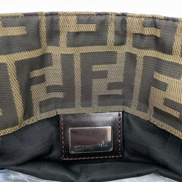 Fendi brown duffel bag featuring iconic Zucca monogram canvas and leather handles.