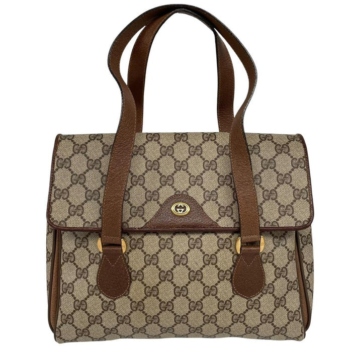 Gucci brown duffel bag with monogram canvas and top handle design.