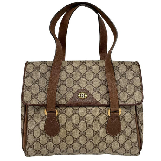 Gucci brown duffel bag with monogram canvas and top handle design.