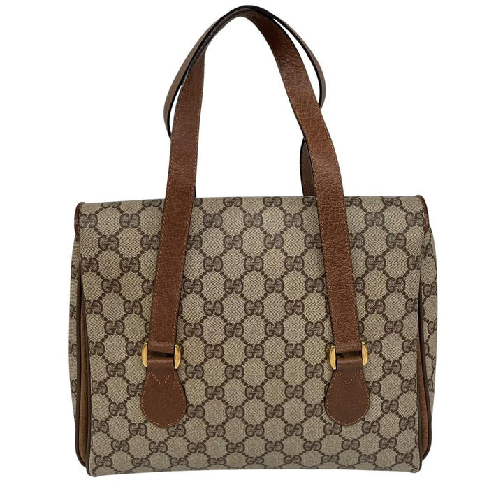 Gucci brown duffel bag with monogram canvas and top handle design.