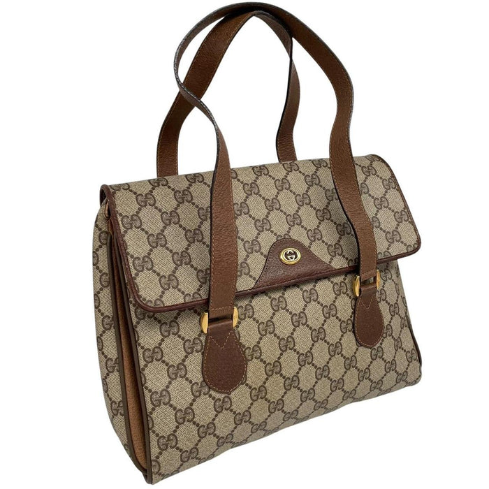 Gucci brown duffel bag with monogram canvas and top handle design.