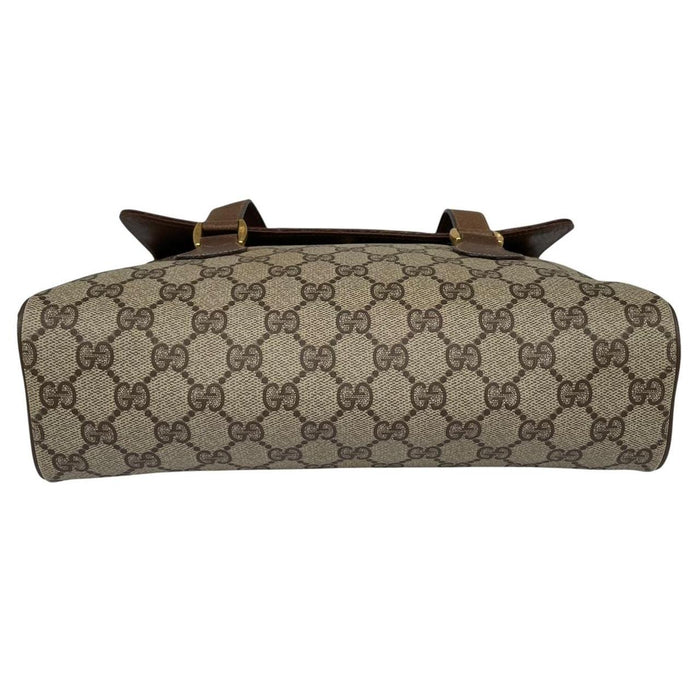 Gucci brown duffel bag with monogram canvas and top handle design.