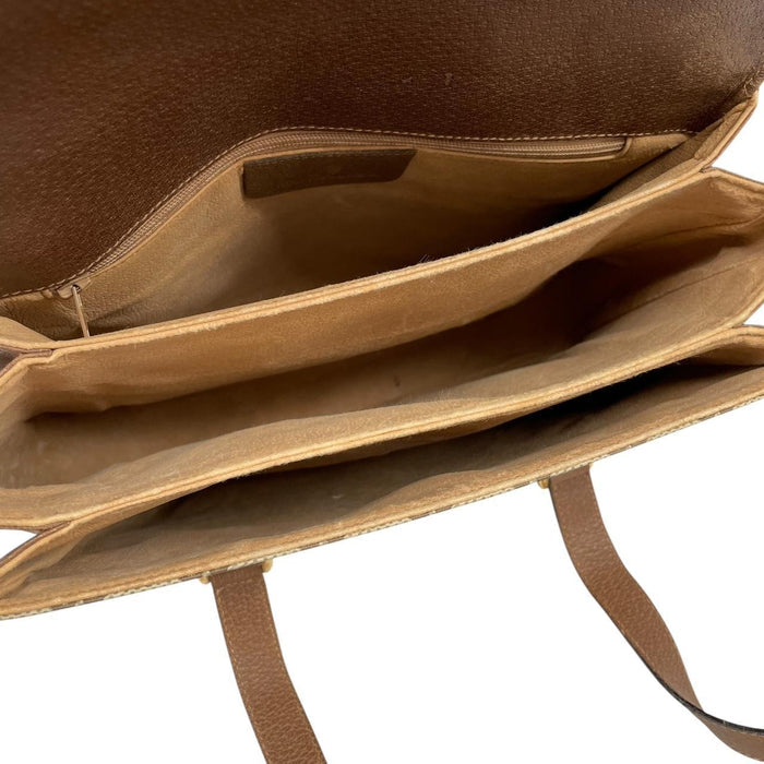 Gucci brown duffel bag with monogram canvas and top handle design.
