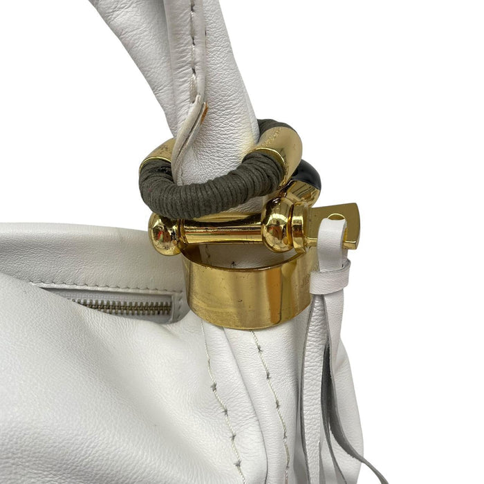 Jimmy Choo white leather hobo bag with subtle marks and logo detail.