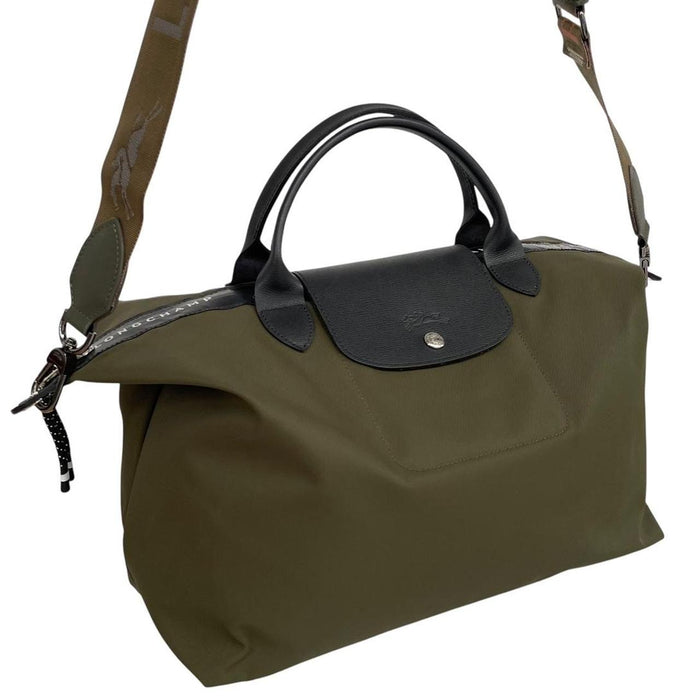 Longchamp green Le Pliage Enery tote bag with logo and durable nylon material.