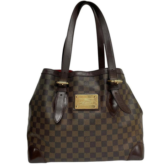 Louis Vuitton brown duffel bag with Damier Ebene pattern and logo plaque details.