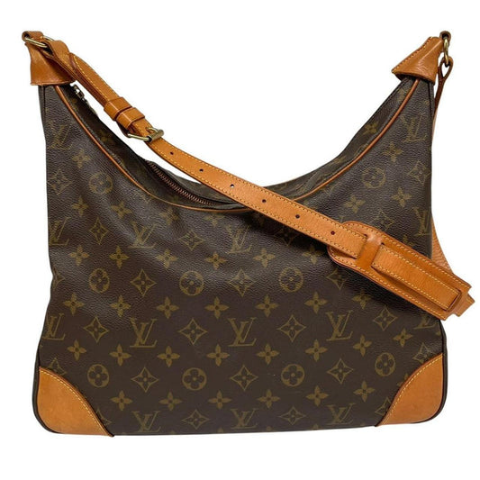 Louis Vuitton brown and tan monogram canvas duffel bag with leather accents and logo.